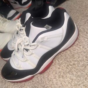 Black and White Sneakers with Red Soles